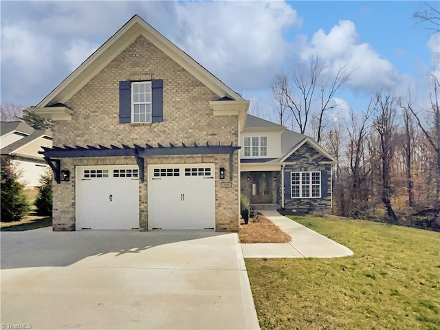 traditional home featuring brick siding, a garage, driveway, and a front yard