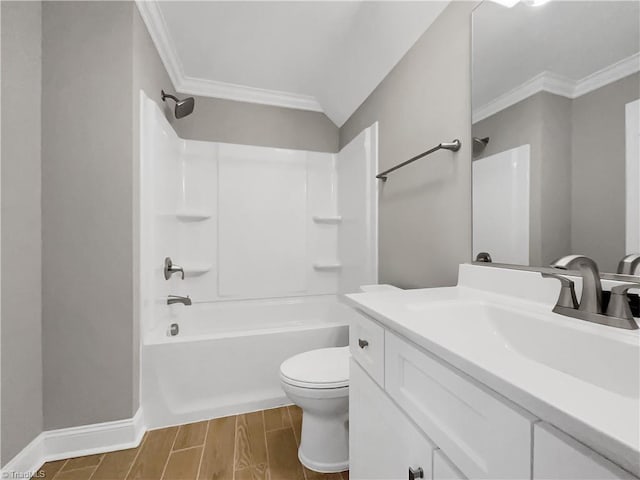 bathroom with vanity, wood finish floors, ornamental molding, shower / bathing tub combination, and toilet