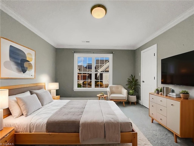 bedroom featuring ornamental molding, visible vents, and light carpet