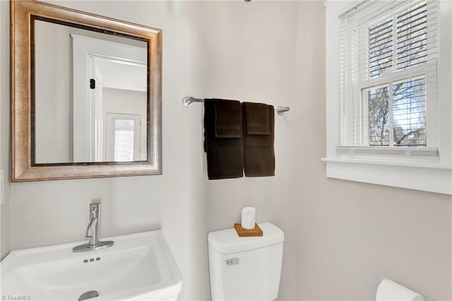 bathroom with toilet and sink