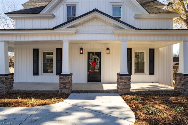 entrance to property featuring a porch