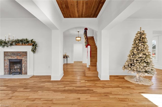 corridor featuring crown molding and light wood-type flooring