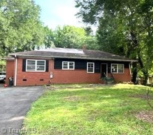 2804 Buchanan Rd, Greensboro, NC 27405 - single story home with a front yard, driveway, and entry steps
