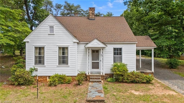 401 Byerly Rd, Winston-Salem, NC 27101 - view of front of house featuring a chimney, gravel driveway, and a shingled roof