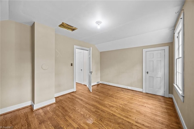 401 Byerly Rd, Winston-Salem, NC 27101 - unfurnished bedroom with lofted ceiling, baseboards, and wood finished floors