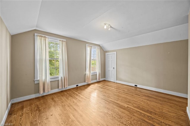 401 Byerly Rd, Winston-Salem, NC 27101 - empty room with vaulted ceiling, wood finished floors, and baseboards