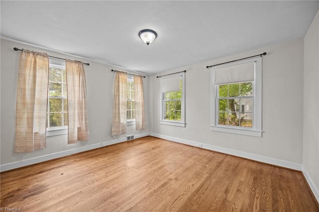401 Byerly Rd, Winston-Salem, NC 27101 - spare room with baseboards, wood finished floors, and plenty of natural light