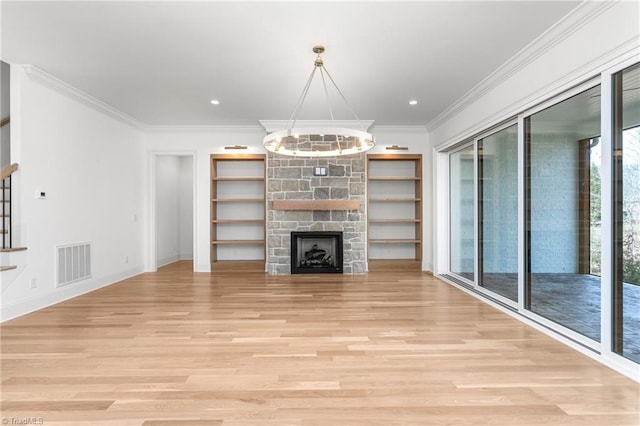 unfurnished living room featuring visible vents, stairway, ornamental molding, light wood-style flooring, and an inviting chandelier