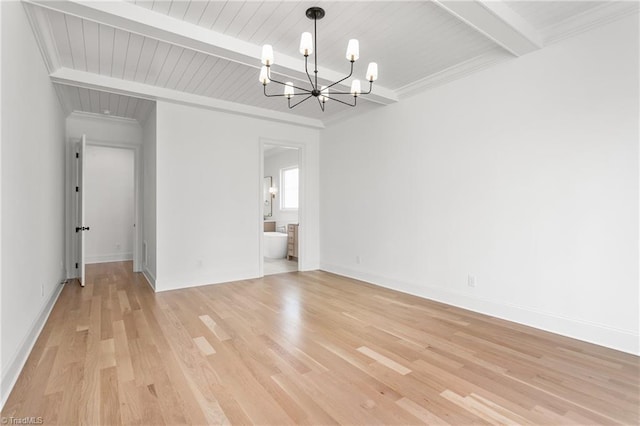 unfurnished dining area with baseboards, light wood finished floors, an inviting chandelier, beam ceiling, and crown molding