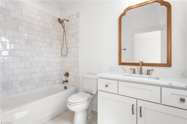 bathroom with vanity, bathing tub / shower combination, and toilet