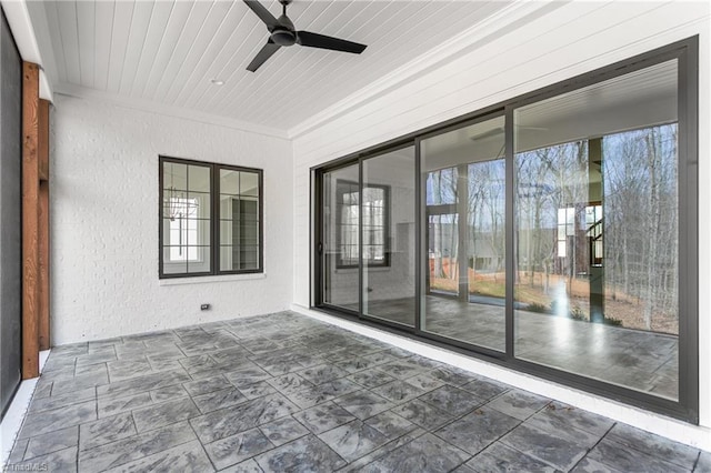 exterior space with wood ceiling and a ceiling fan