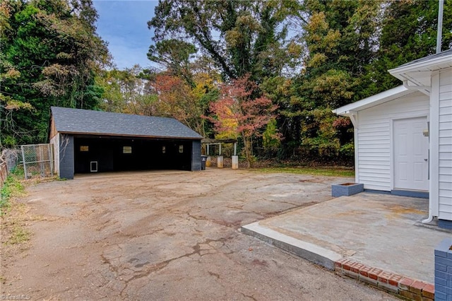 view of patio with an outbuilding