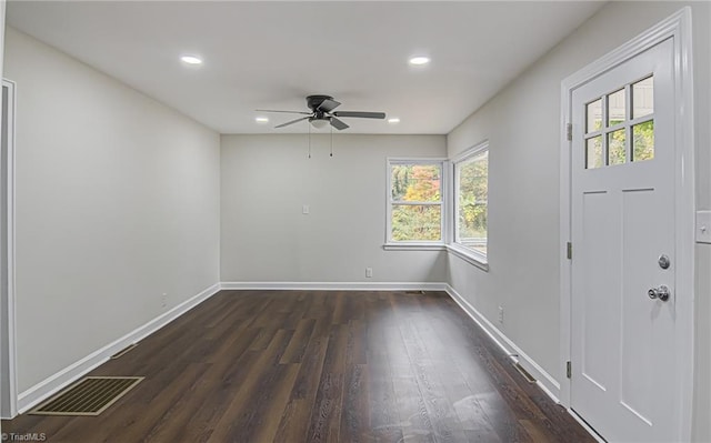 entryway with ceiling fan and dark hardwood / wood-style flooring