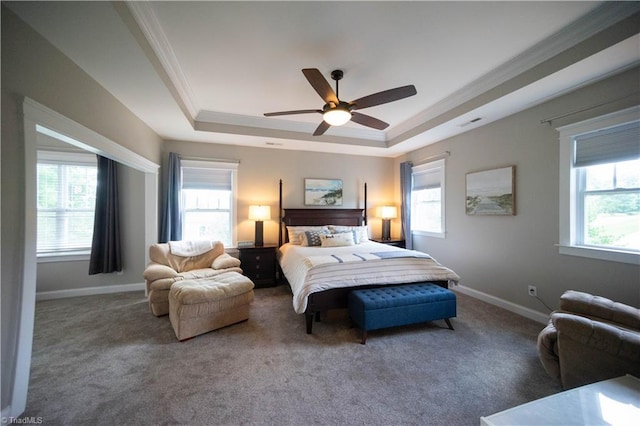 bedroom featuring carpet flooring, ceiling fan, crown molding, and a tray ceiling