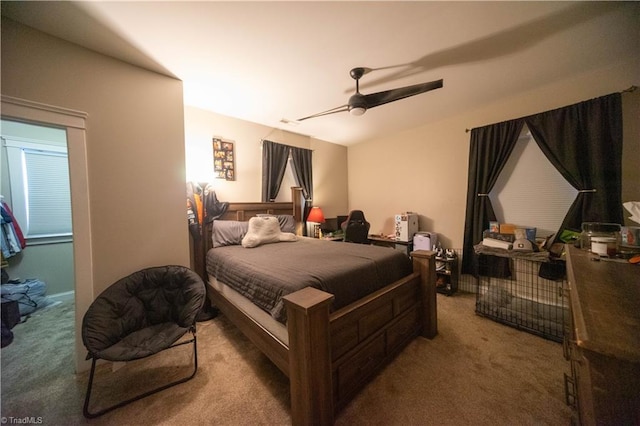 bedroom featuring ceiling fan and carpet