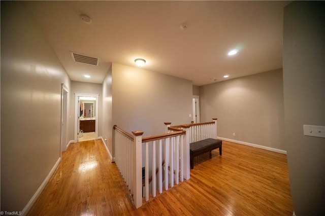 hallway with light hardwood / wood-style flooring