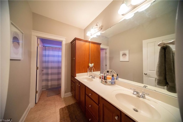 bathroom featuring tile patterned flooring and vanity