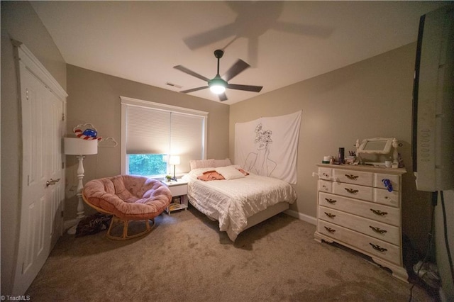 bedroom with ceiling fan and carpet floors