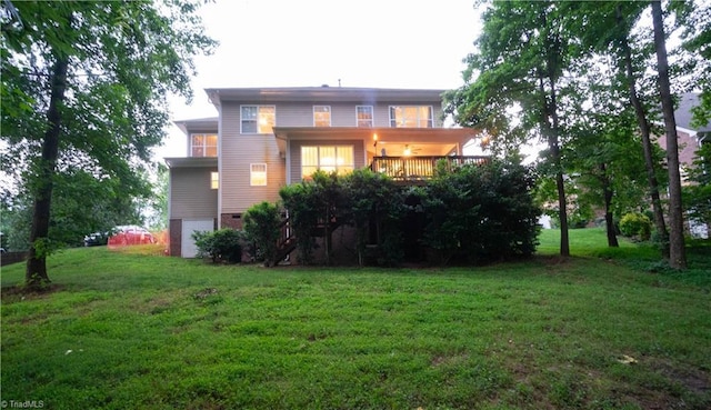 rear view of property with a lawn