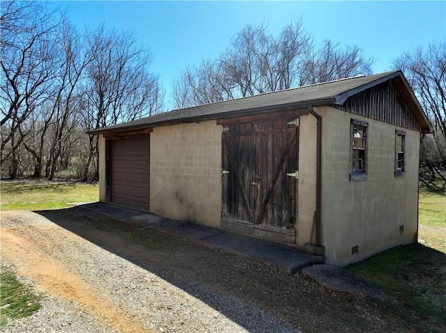 view of outbuilding with an outbuilding and driveway