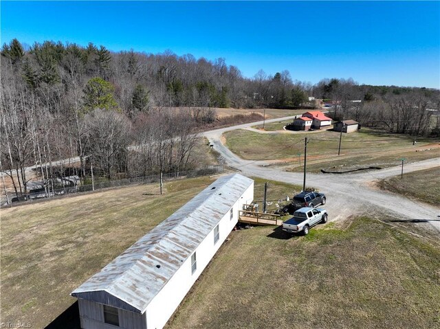 view of street featuring a rural view and a view of trees