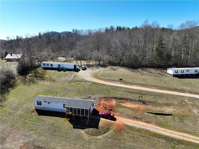 aerial view with a rural view and a view of trees