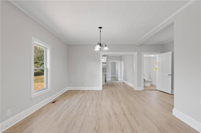 interior space with ornamental molding, a notable chandelier, and light wood-type flooring