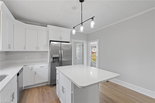 kitchen with white cabinetry, a center island, light hardwood / wood-style floors, and appliances with stainless steel finishes