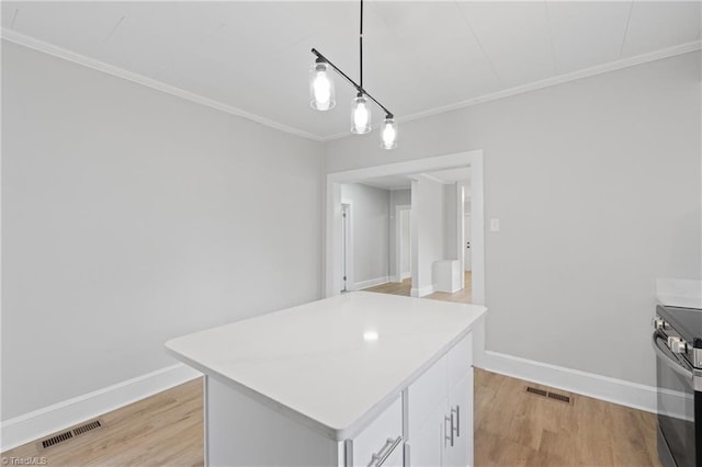 kitchen with light wood-type flooring, stainless steel electric range oven, a center island, white cabinetry, and hanging light fixtures