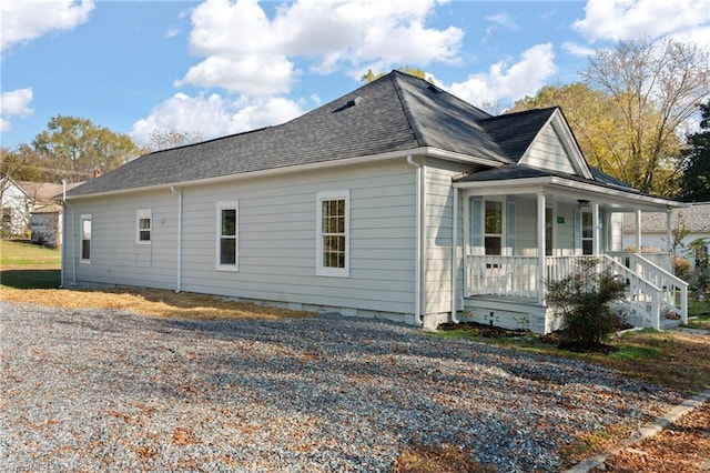 view of side of property featuring a porch