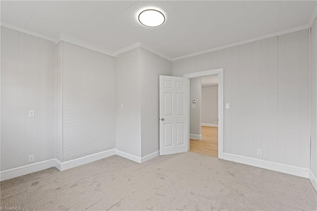 carpeted empty room with ornamental molding