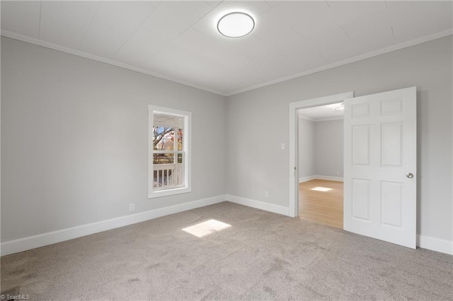 unfurnished bedroom featuring carpet flooring and crown molding