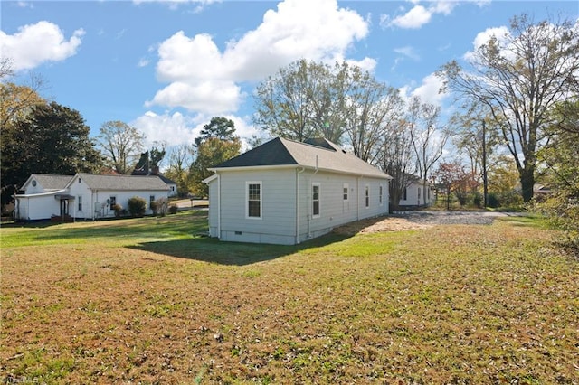 view of property exterior with a lawn