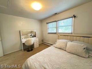 bedroom featuring a baseboard radiator