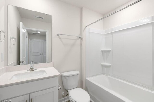 full bathroom featuring vanity, toilet, and bathing tub / shower combination