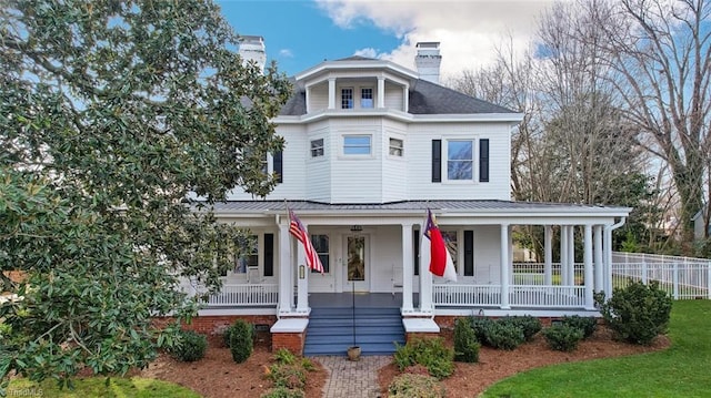 521 Patrick St, Eden, NC 27288 - view of front of house featuring covered porch, a chimney, metal roof, and a standing seam roof