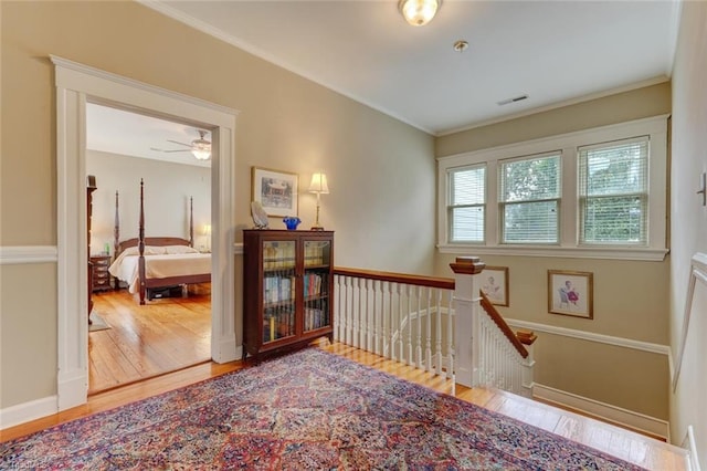 521 Patrick St, Eden, NC 27288 - hall with an upstairs landing, wood finished floors, and ornamental molding