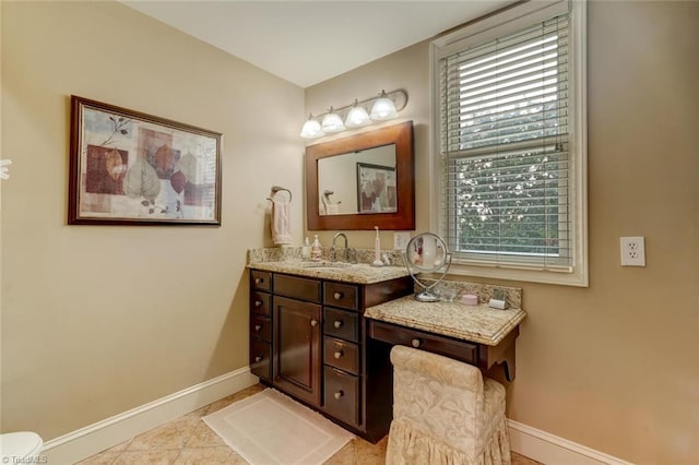 521 Patrick St, Eden, NC 27288 - bathroom with baseboards, vanity, plenty of natural light, and tile patterned flooring