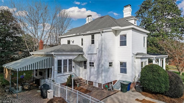 521 Patrick St, Eden, NC 27288 - rear view of house featuring a chimney, a patio area, central AC unit, and entry steps