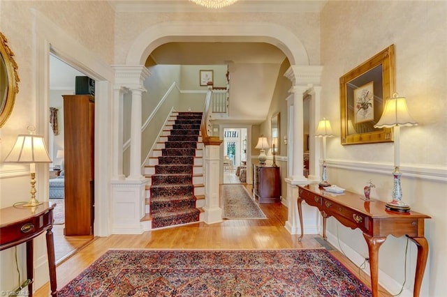 521 Patrick St, Eden, NC 27288 - entrance foyer with wood finished floors, decorative columns, arched walkways, stairway, and crown molding