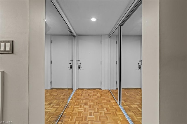 hallway with light parquet flooring