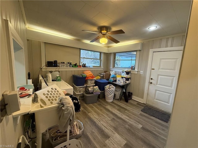 misc room featuring ceiling fan, ornamental molding, and hardwood / wood-style floors