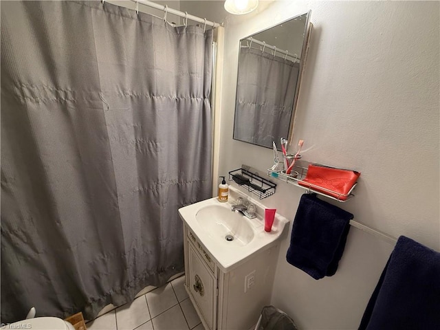 bathroom featuring vanity, curtained shower, and tile patterned floors