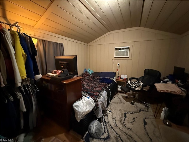 bedroom featuring lofted ceiling, a wall unit AC, and wooden ceiling