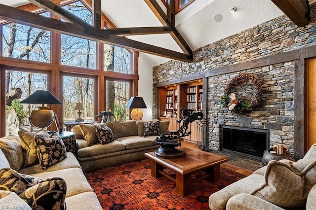 living room featuring beam ceiling, high vaulted ceiling, and a fireplace