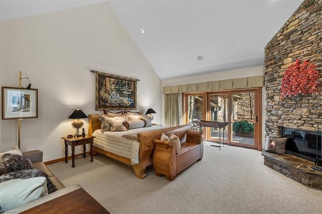 bedroom featuring carpet floors, high vaulted ceiling, a fireplace, and access to outside