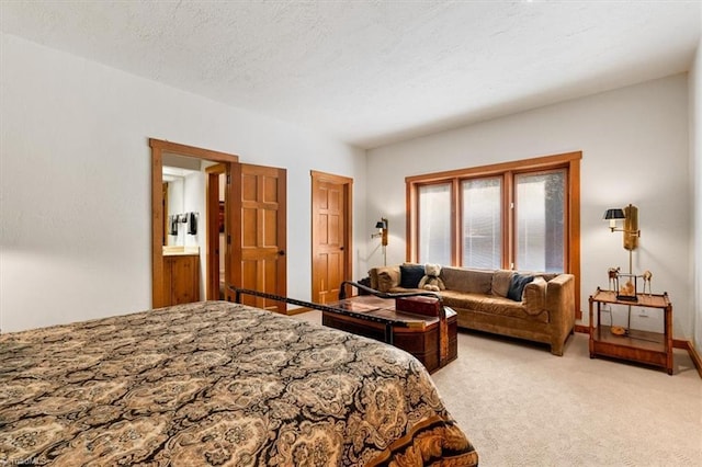 bedroom featuring carpet and a textured ceiling