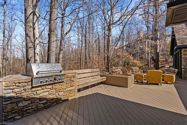 wooden deck with area for grilling