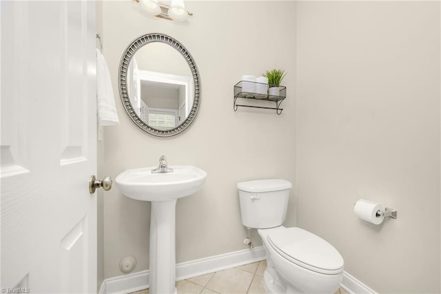 7255 Orchard Path Dr, Clemmons, NC 27012 - half bathroom with toilet, baseboards, tile patterned flooring, and a sink