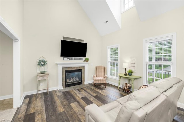 7255 Orchard Path Dr, Clemmons, NC 27012 - living area featuring high vaulted ceiling, wood finished floors, a tile fireplace, and baseboards